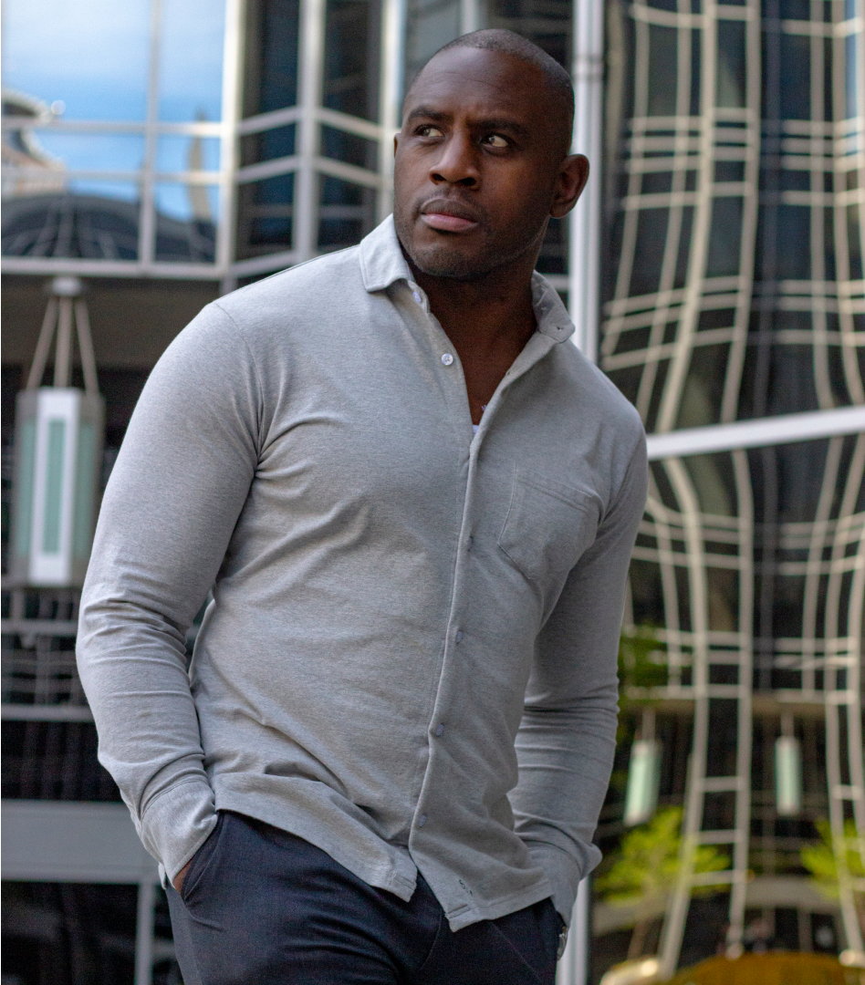 Ed Latimore standing in front of a glass building