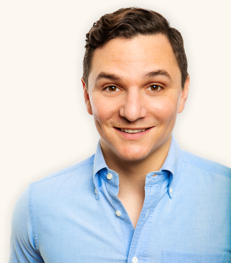 Photo of Jonathan Schwartz wearing a light blue oxford cloth button-down shirt